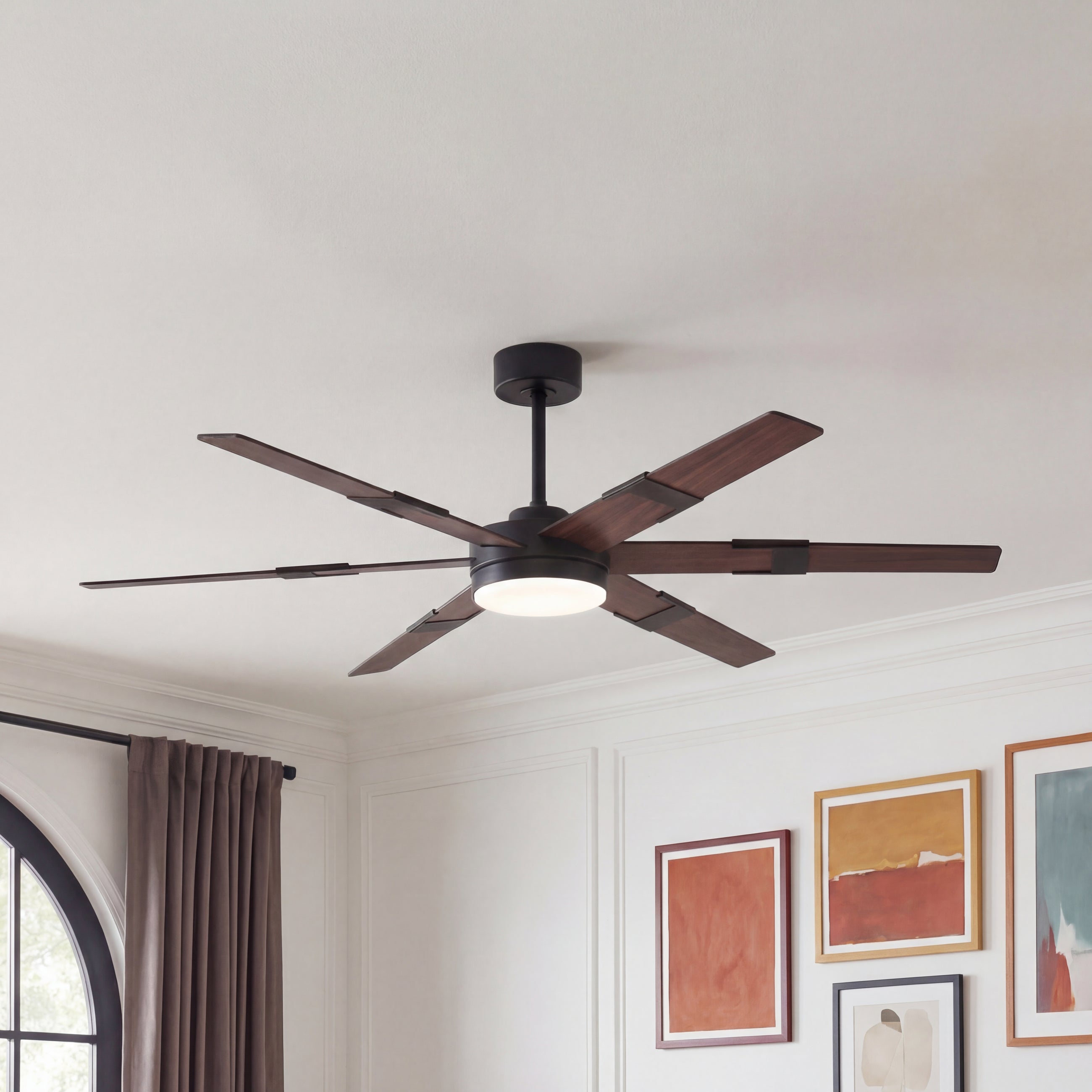 Modern ceiling fan with wood blades and integrated light in a contemporary living room.