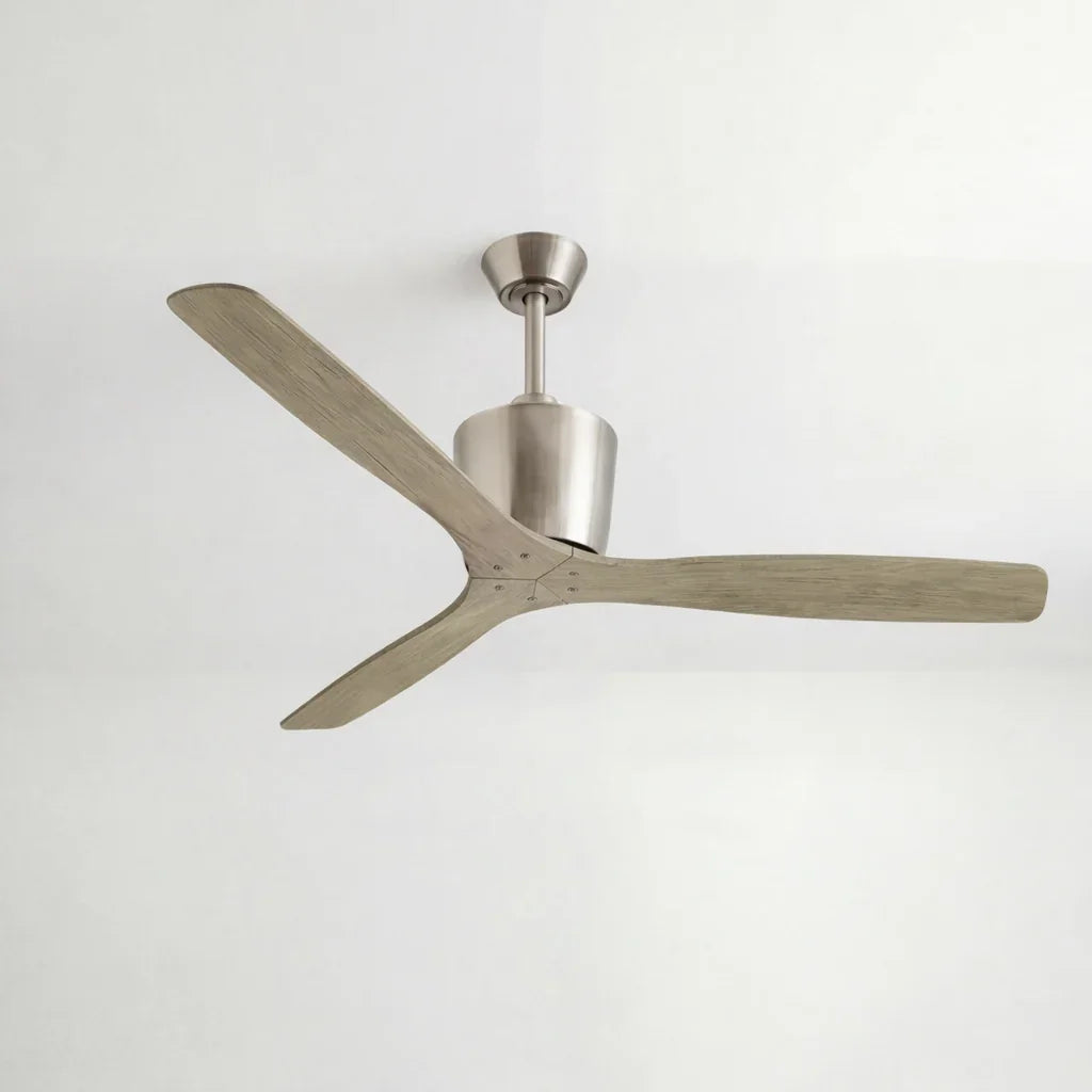 Modern ceiling fan with brushed metal fixture and three wood blades against a white ceiling