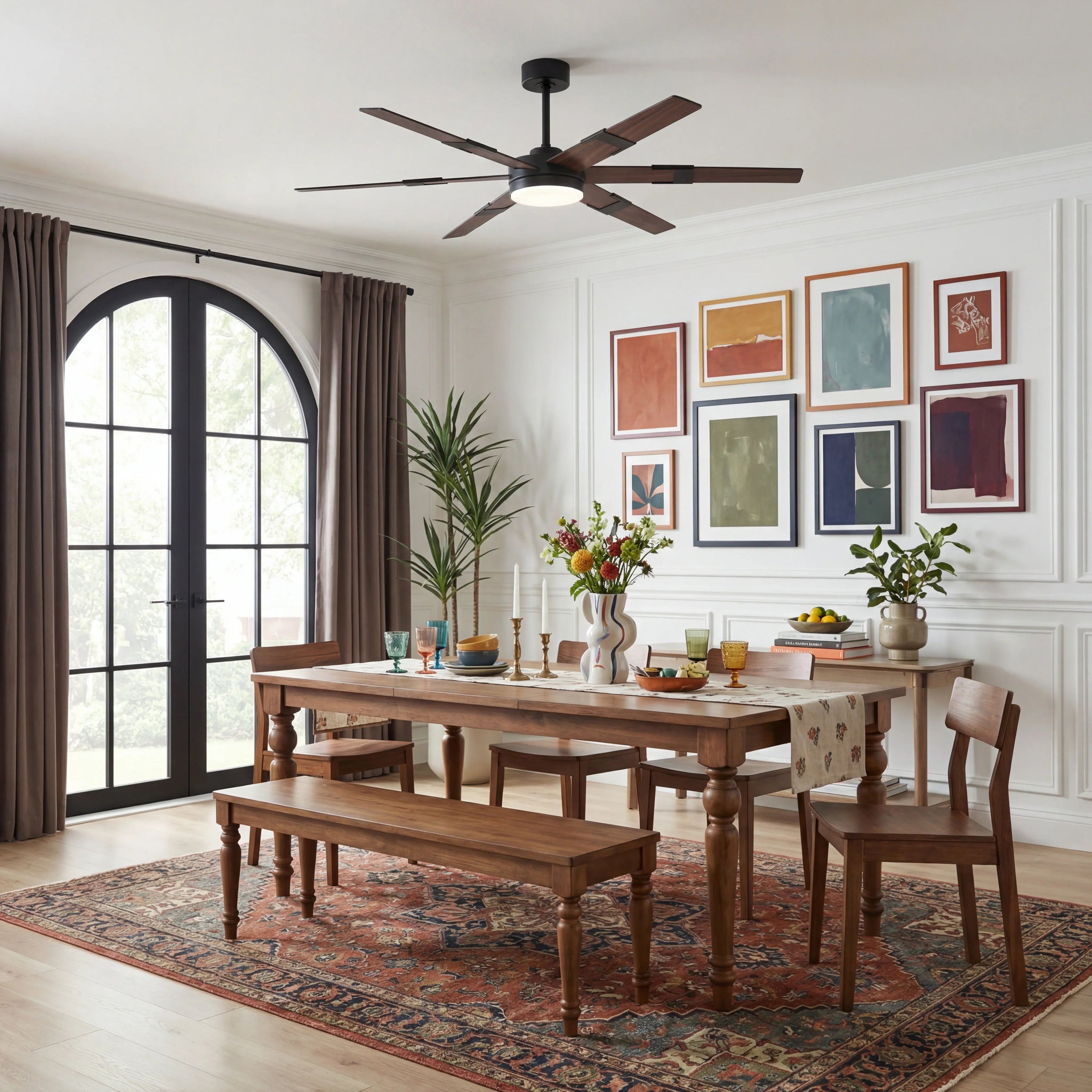 Modern ceiling fan with wood blades in a bright dining room with wooden table and art decor