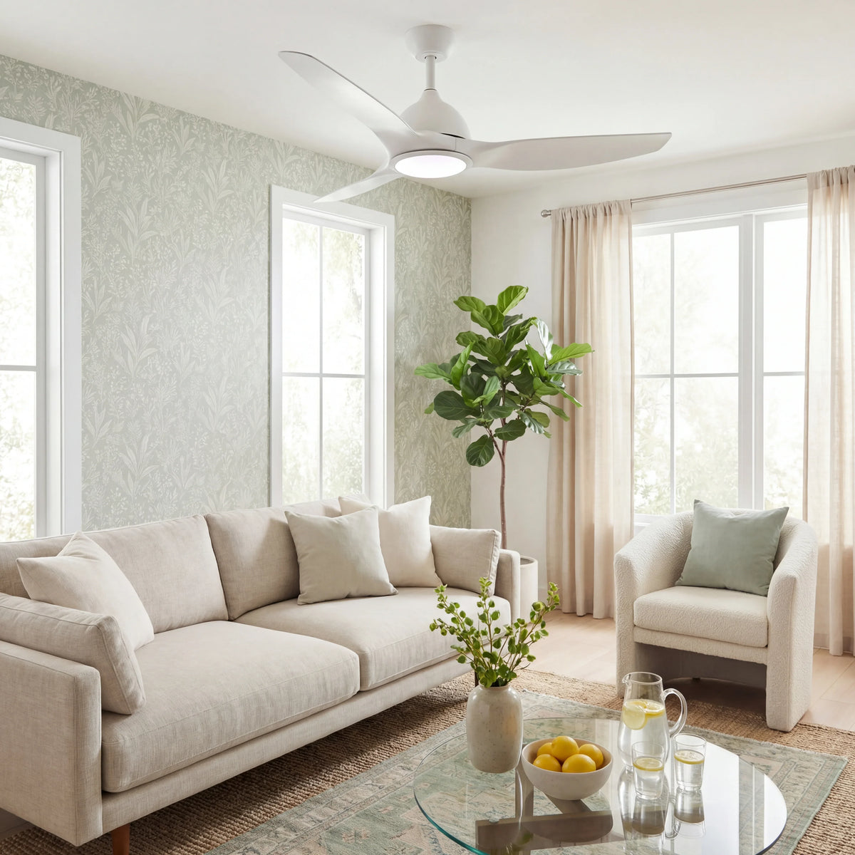 Modern white ceiling fan with integrated LED light in a bright living room with beige furniture