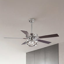 Modern silver ceiling fan with sleek blades and integrated light fixture in a minimalist room