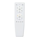 White ceiling fan remote control with multiple speed and timer buttons, isolated on white background.