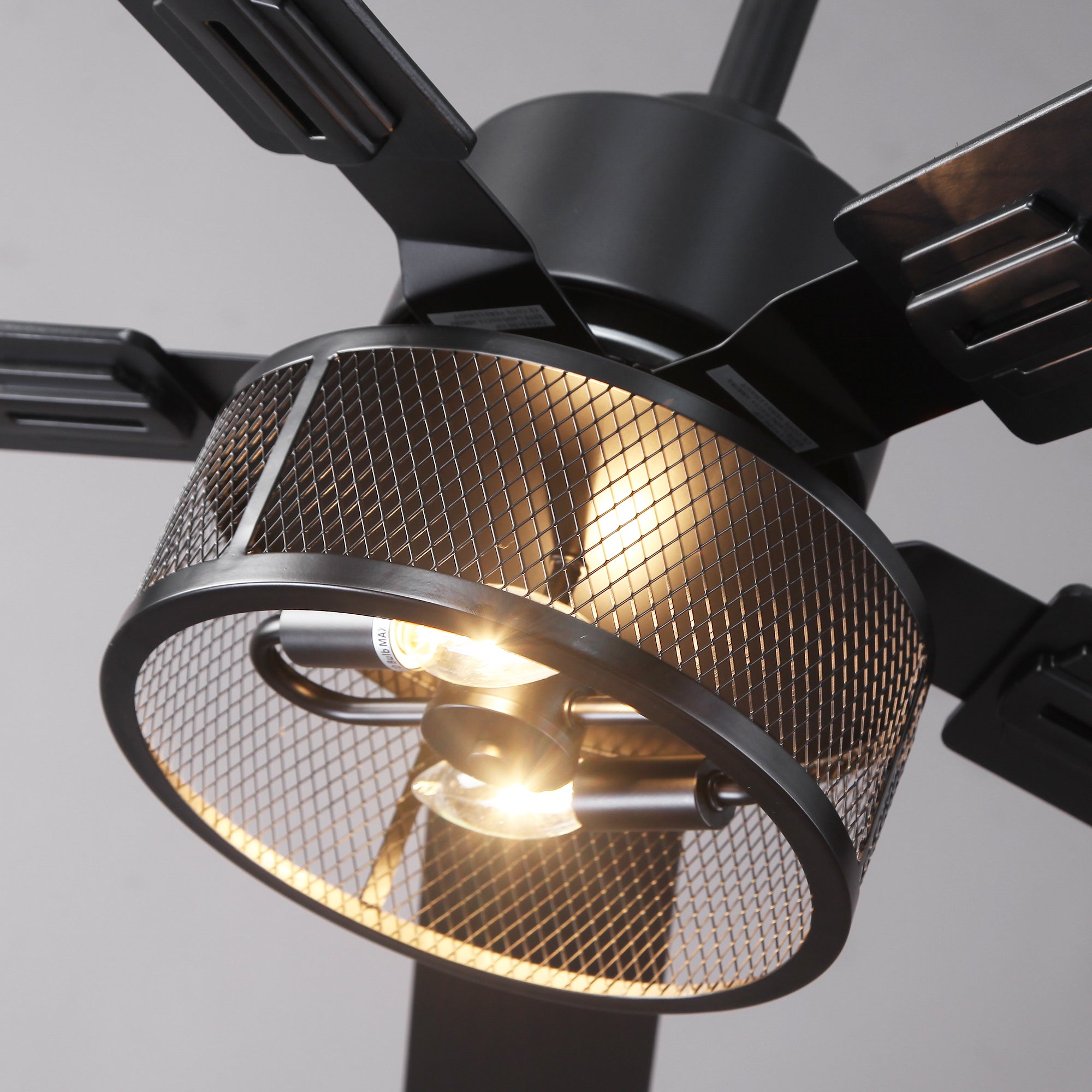 Modern black industrial ceiling fan with cage-style LED light fixture
