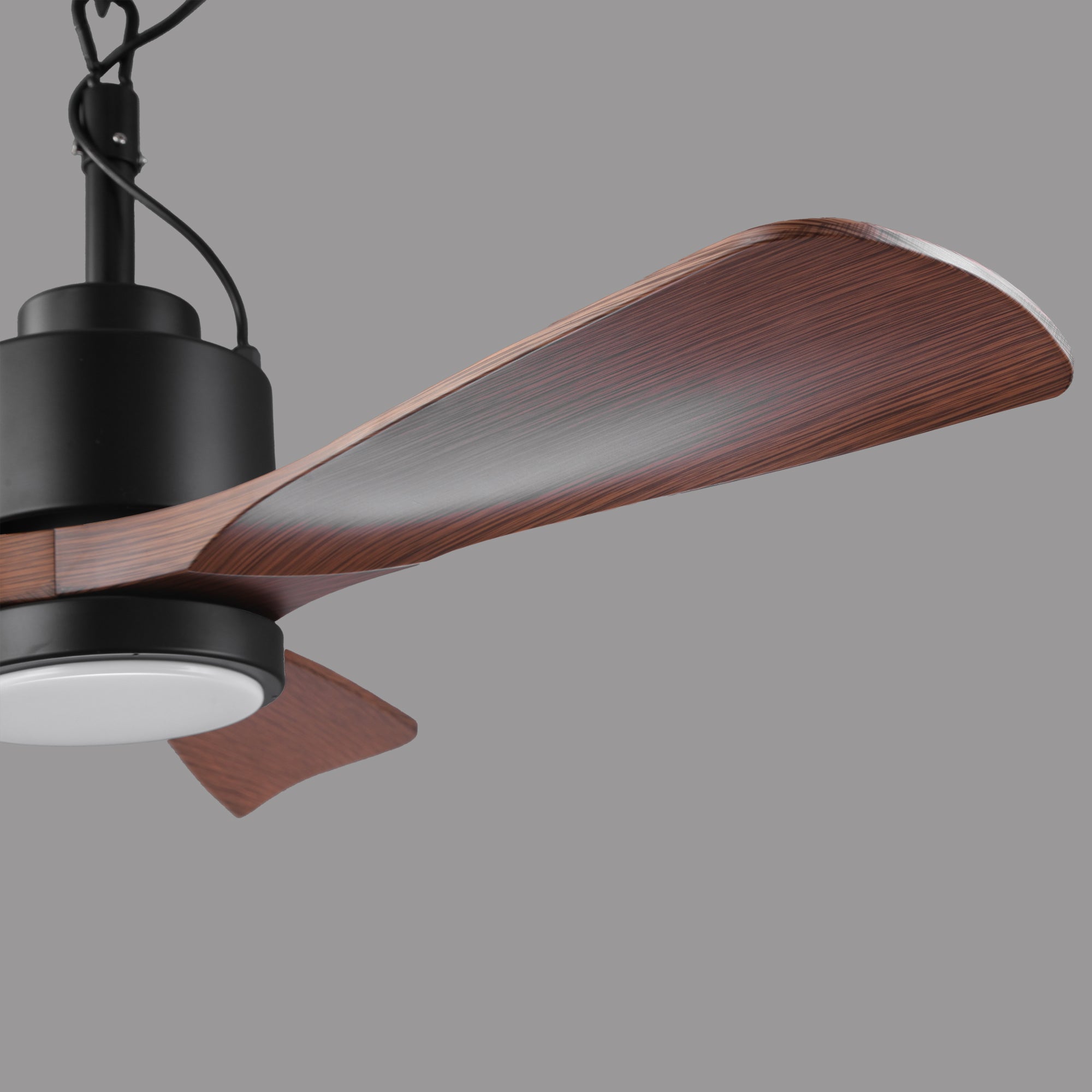 Modern ceiling fan with wood finish blades and integrated LED light on grey background