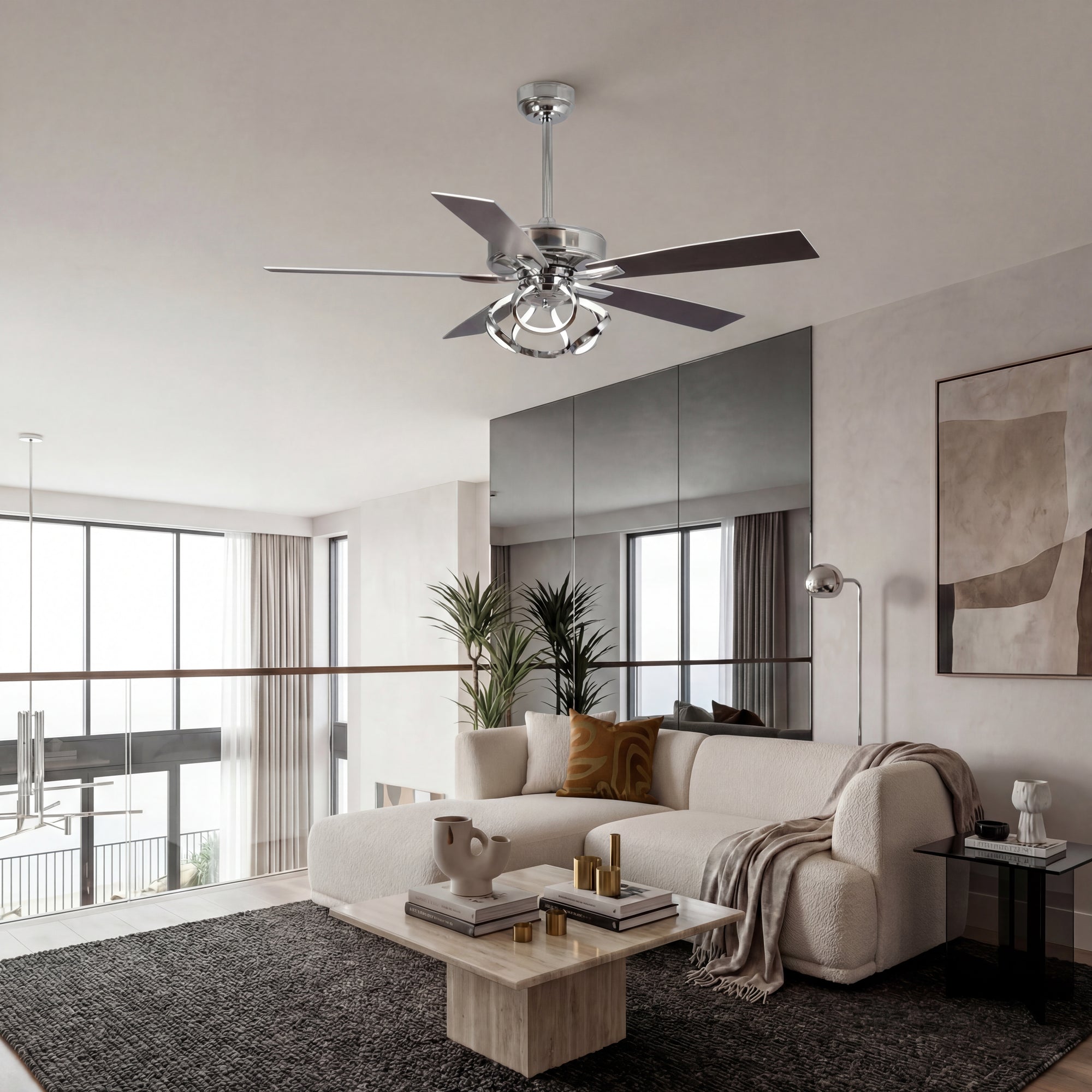 Modern chrome ceiling fan with light in a contemporary living room with neutral decor.