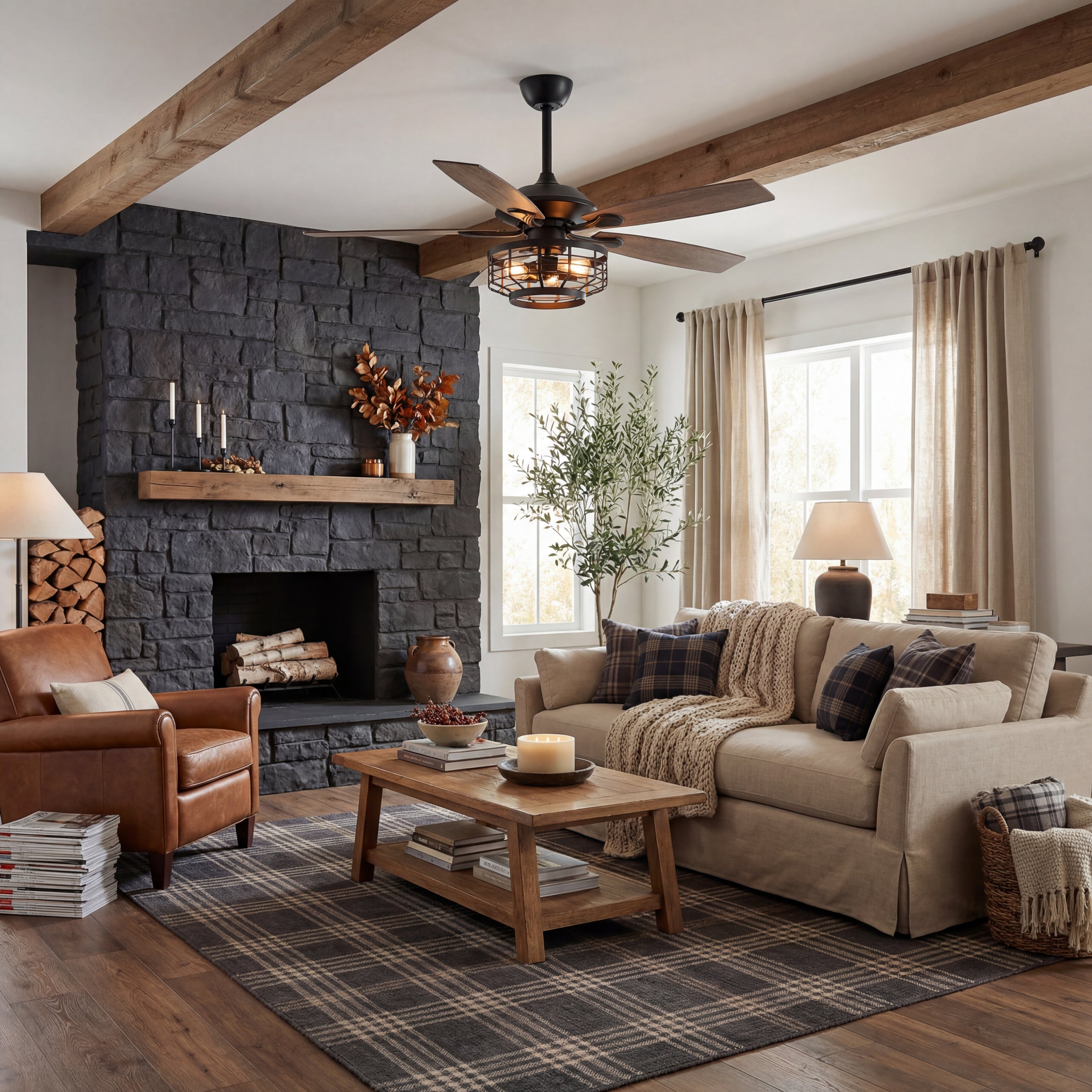 Modern living room with wood ceiling fan, black stone fireplace, and cozy neutral decor