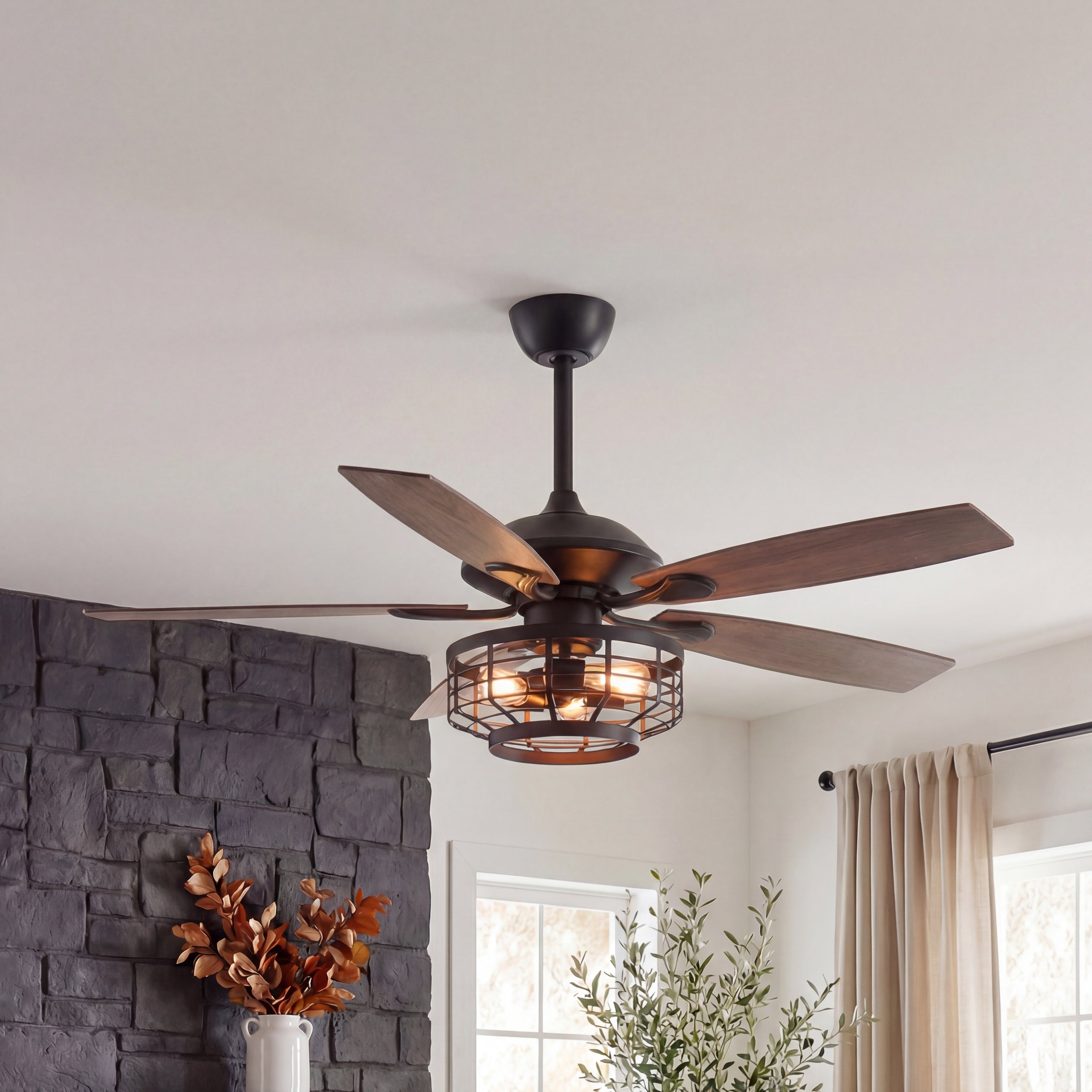 Industrial ceiling fan with wood blades and cage light in modern living room setting